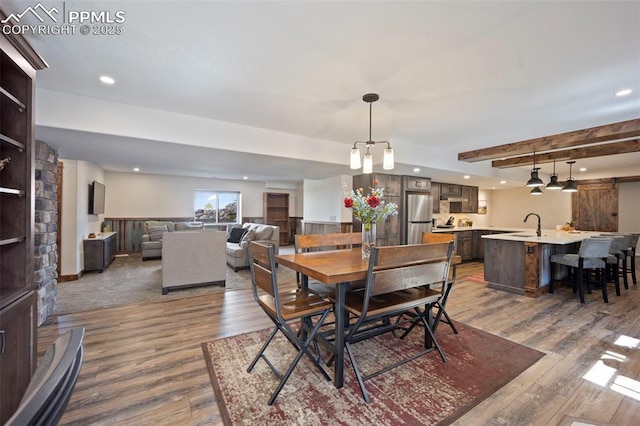 14650 Eastonville Rd, Elbert, CO 80106 - dining space featuring recessed lighting, wood finished floors, and beam ceiling