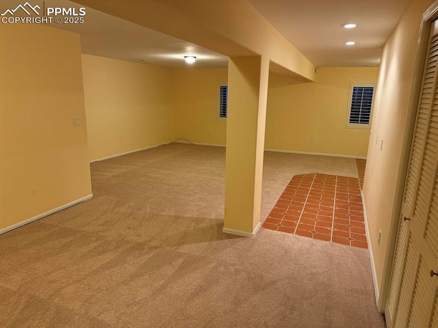 finished basement featuring recessed lighting, baseboards, and carpet floors