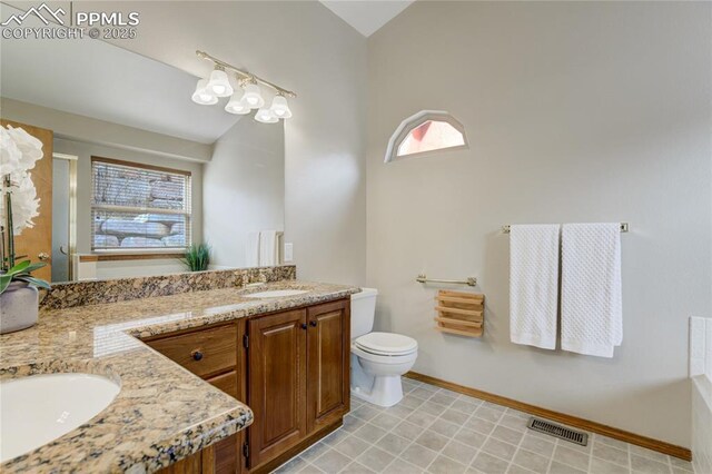 full bathroom with a sink, double vanity, visible vents, and toilet