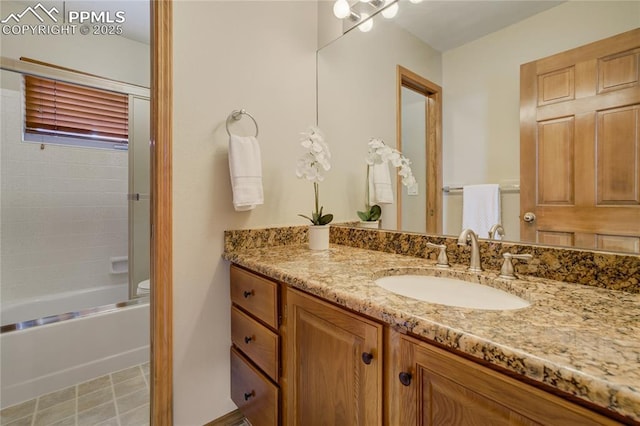 full bathroom with tile patterned floors, vanity, and tub / shower combination