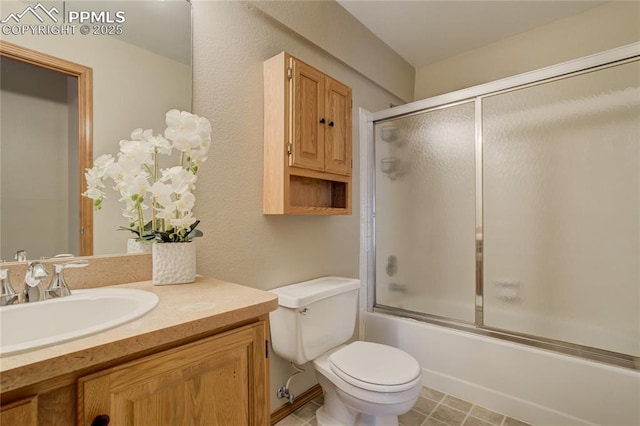 full bathroom with toilet, shower / bath combination with glass door, and vanity