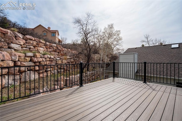 wooden deck with a garage