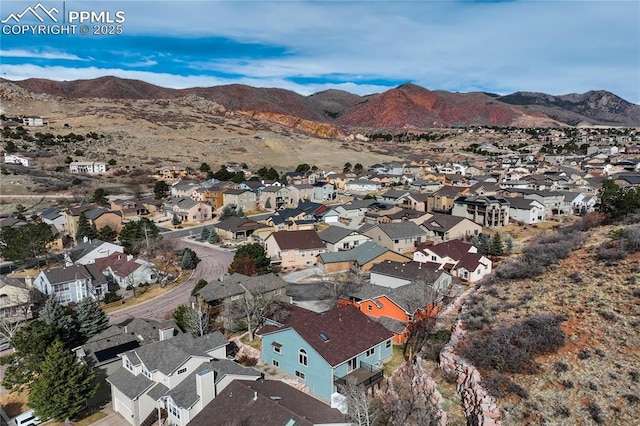 drone / aerial view with a residential view and a mountain view