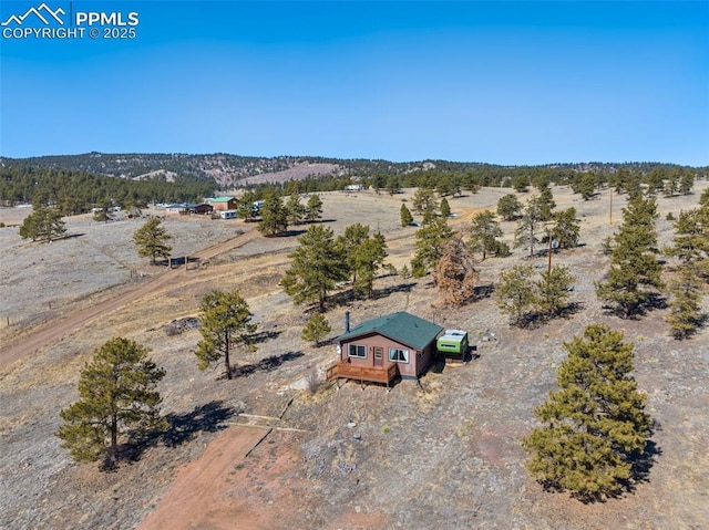 birds eye view of property with a rural view