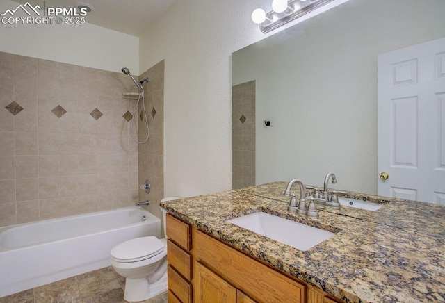 bathroom with vanity, bathing tub / shower combination, and toilet