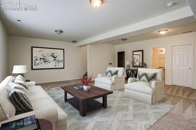 living area featuring carpet flooring and visible vents