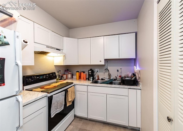 kitchen featuring under cabinet range hood, light countertops, white cabinets, white appliances, and a sink