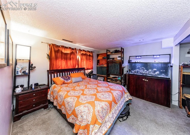 carpeted bedroom with visible vents and a textured ceiling