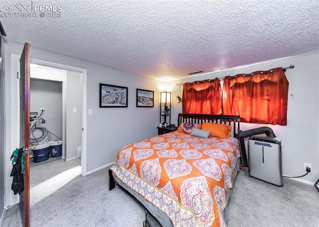 carpeted bedroom with visible vents, baseboards, and a textured ceiling