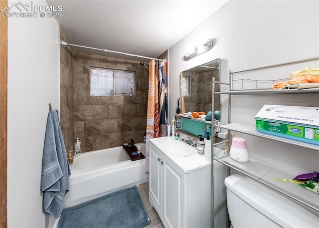 bathroom featuring vanity, toilet, and shower / bath combo with shower curtain