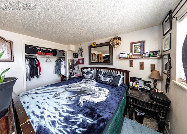 bedroom with a closet and a textured ceiling