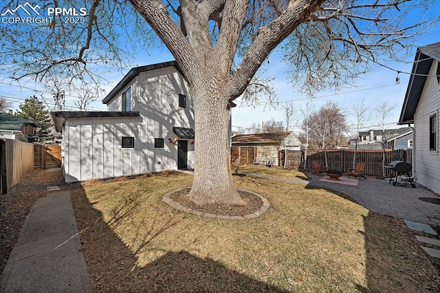 view of yard with a patio area and a fenced backyard