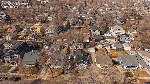 birds eye view of property with a residential view