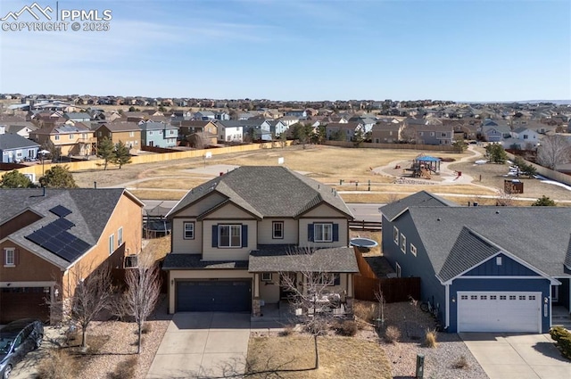 birds eye view of property with a residential view