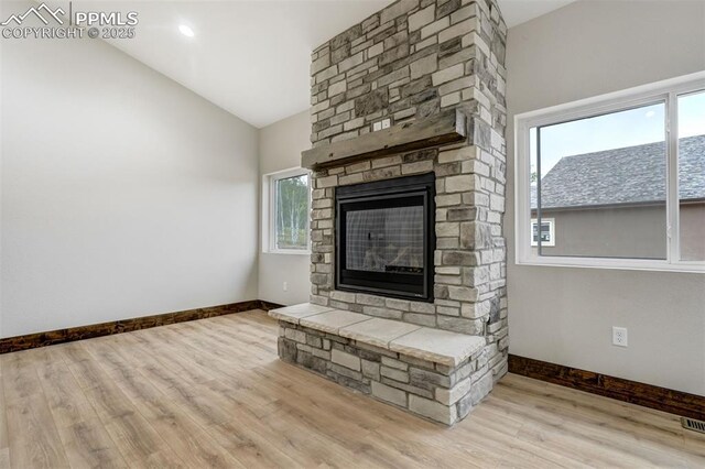 1309 Stone Ridge Dr, Woodland Park, CO 80863 - unfurnished living room with baseboards, wood finished floors, and a fireplace