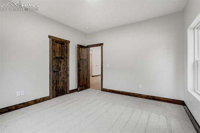 1309 Stone Ridge Dr, Woodland Park, CO 80863 - unfurnished bedroom with baseboards and carpet