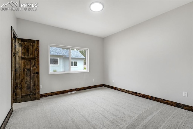 1309 Stone Ridge Dr, Woodland Park, CO 80863 - carpeted spare room featuring visible vents and baseboards