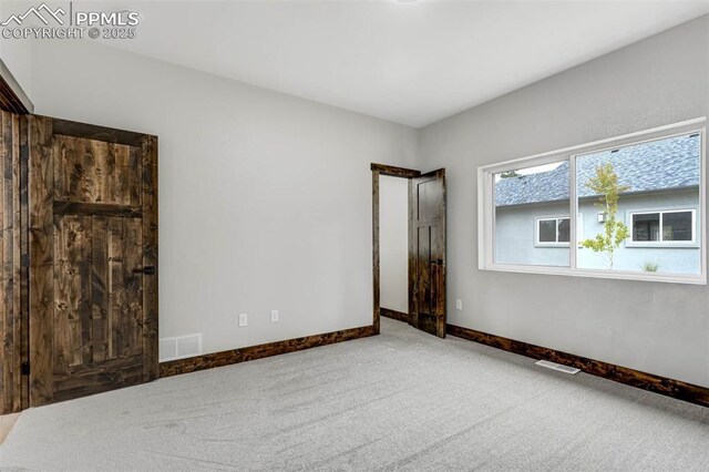 1309 Stone Ridge Dr, Woodland Park, CO 80863 - unfurnished room featuring visible vents, baseboards, and carpet floors