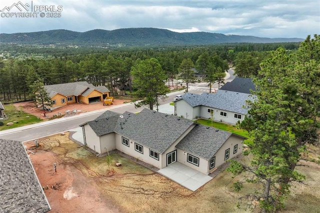 1309 Stone Ridge Dr, Woodland Park, CO 80863 - aerial view featuring a mountain view and a forest view