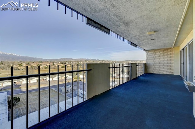 balcony featuring a mountain view