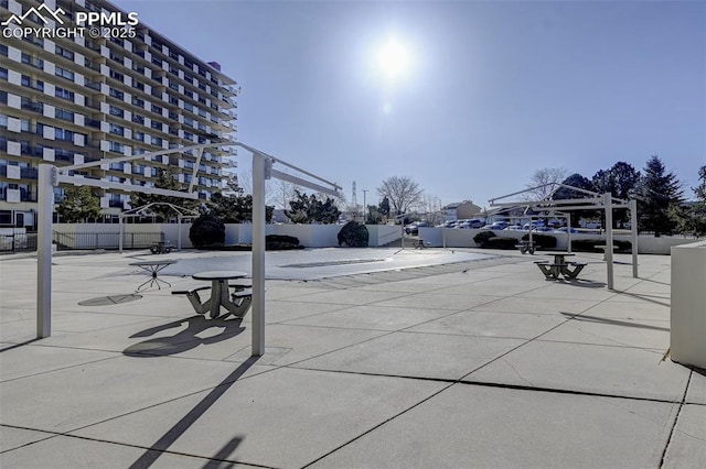 view of home's community featuring a patio and fence