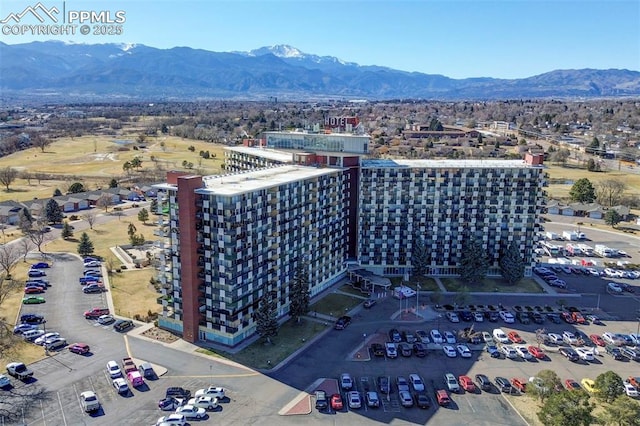 birds eye view of property featuring a city view and a mountain view