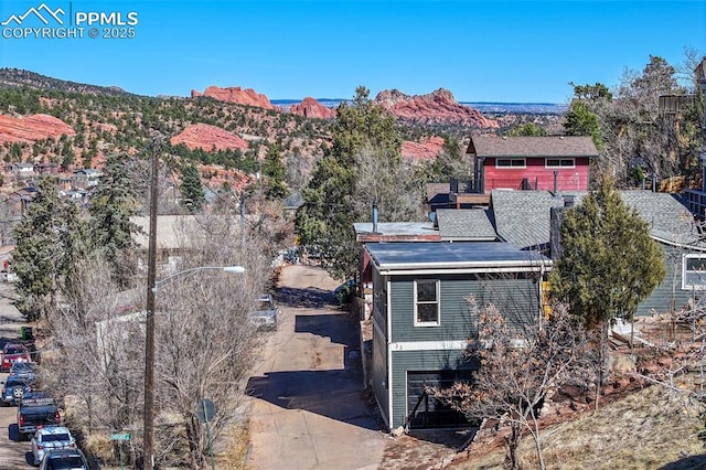 drone / aerial view featuring a mountain view