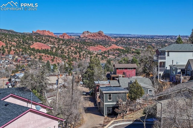 birds eye view of property featuring a mountain view