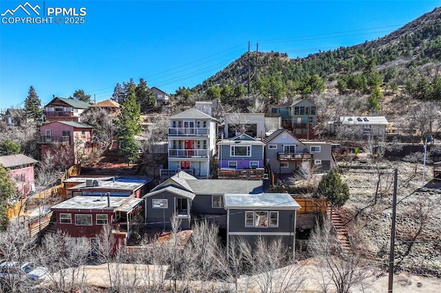 exterior space with a mountain view and a residential view