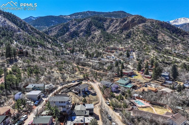 birds eye view of property featuring a mountain view