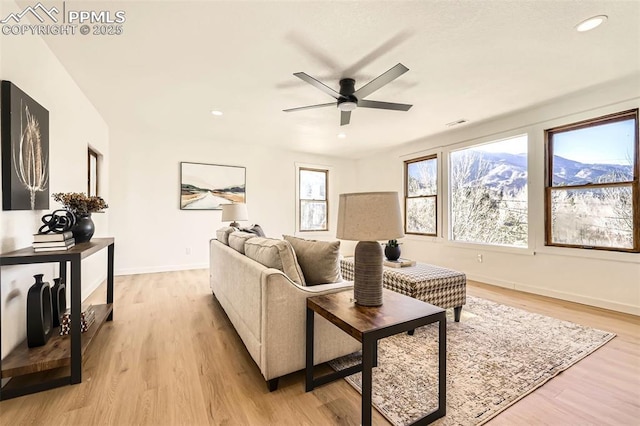 living area with visible vents, recessed lighting, light wood finished floors, baseboards, and ceiling fan