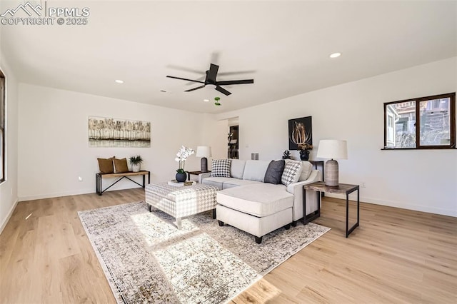 living area featuring recessed lighting, light wood-style flooring, and baseboards