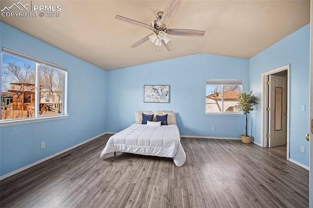 bedroom featuring baseboards, wood finished floors, a ceiling fan, and vaulted ceiling