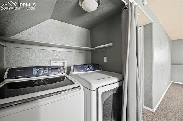 washroom with carpet, baseboards, washing machine and clothes dryer, laundry area, and a textured wall