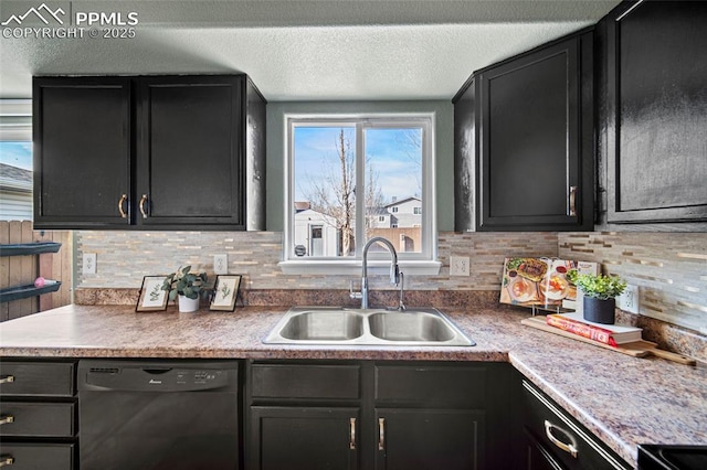 kitchen with a sink, black dishwasher, a textured ceiling, dark cabinetry, and decorative backsplash