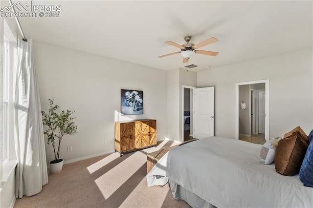 carpeted bedroom with a ceiling fan, baseboards, and visible vents