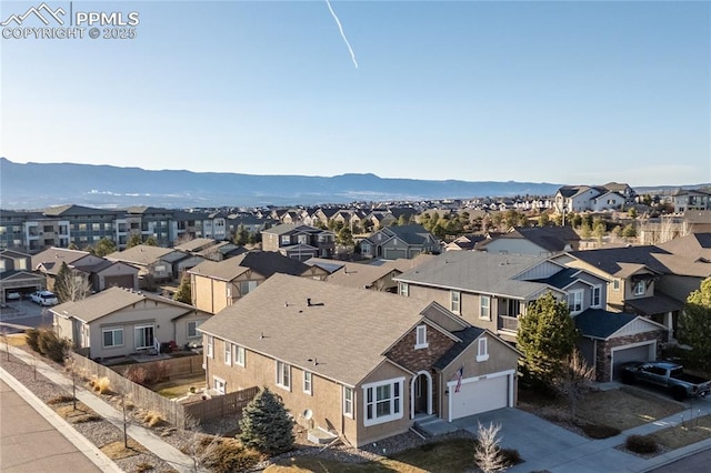 aerial view with a mountain view and a residential view