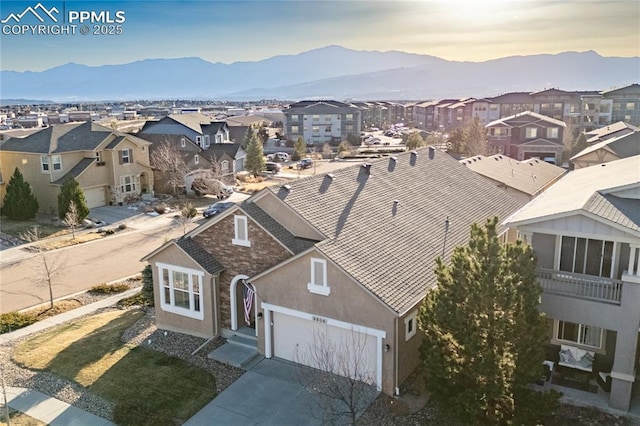 birds eye view of property featuring a residential view and a mountain view