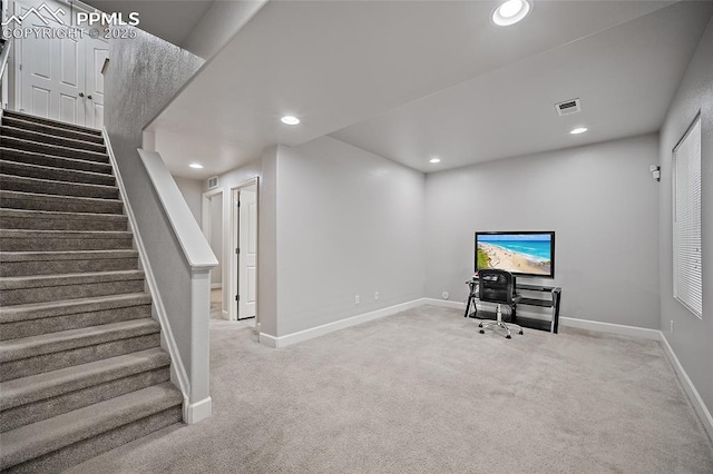 unfurnished office with carpet flooring, visible vents, and recessed lighting