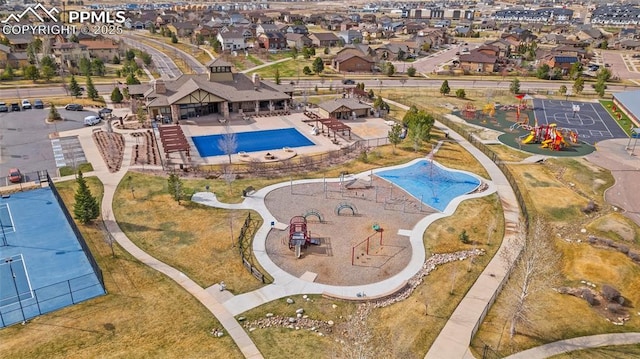 birds eye view of property with a residential view
