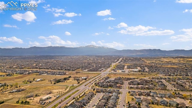 aerial view featuring a mountain view and a residential view