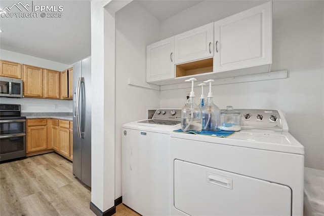 laundry area with light wood finished floors, laundry area, and washer and dryer