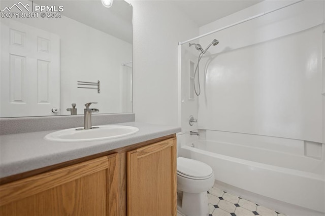 full bath featuring tile patterned floors, bathing tub / shower combination, toilet, and vanity