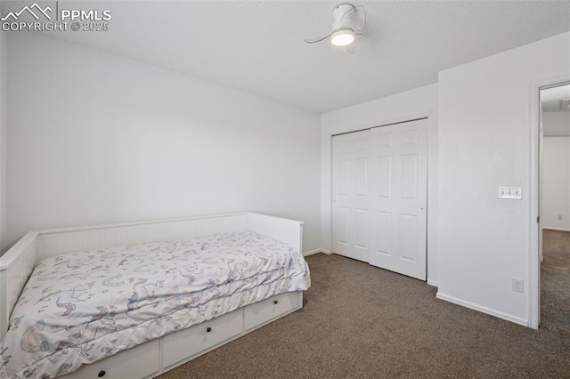 bedroom with a closet, baseboards, and carpet floors