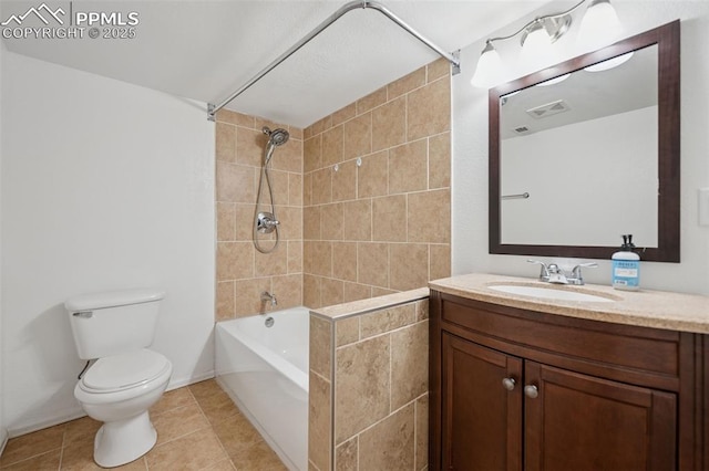 full bathroom with visible vents, washtub / shower combination, toilet, tile patterned floors, and vanity