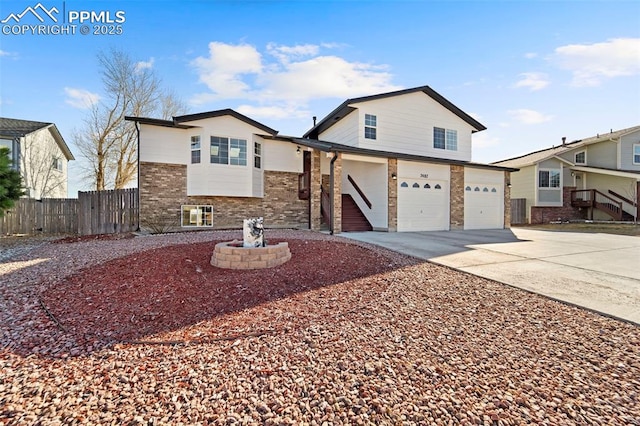 view of front of property featuring central AC, fence, concrete driveway, a garage, and brick siding