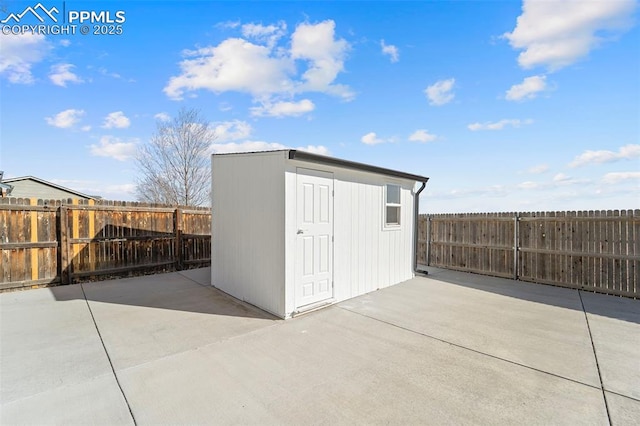 view of shed featuring a fenced backyard