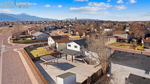 aerial view with a mountain view and a residential view