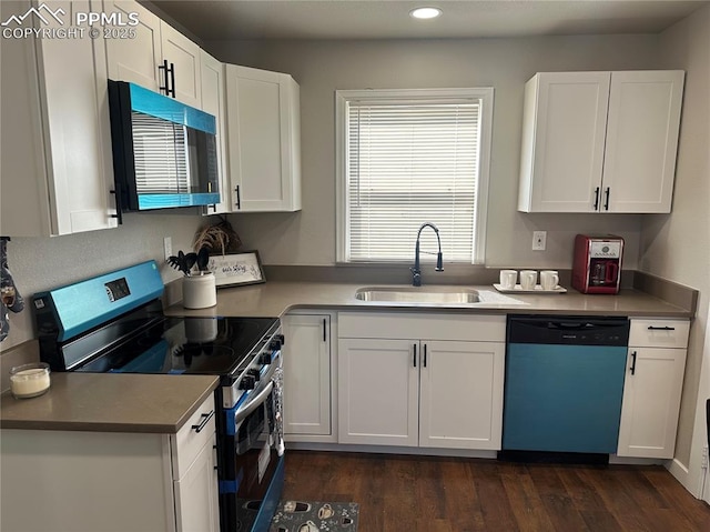 kitchen with dishwashing machine, stainless steel range with electric stovetop, dark wood-style floors, white cabinetry, and a sink