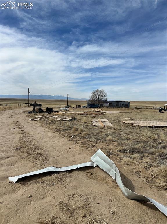 view of yard with a rural view